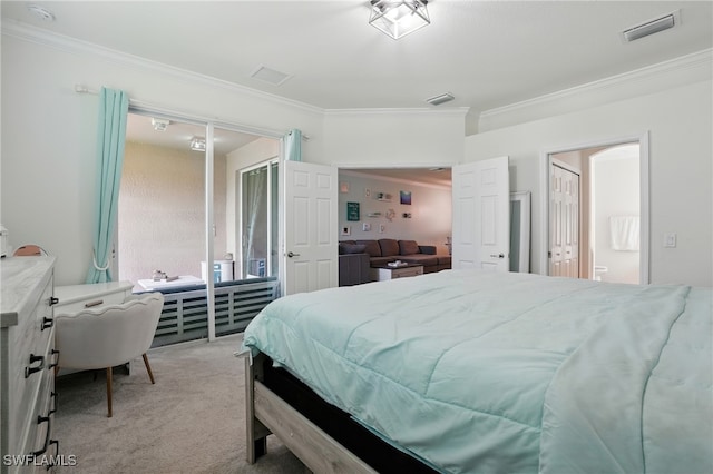1886 Alameda Dr, Naples, FL 34120 - bedroom with ornamental molding, light colored carpet, and ensuite bath