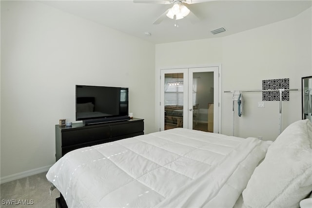 1886 Alameda Dr, Naples, FL 34120 - carpeted bedroom with french doors and a ceiling fan
