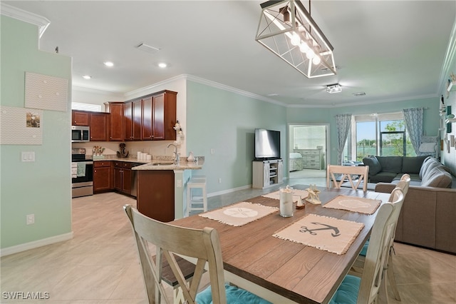 1886 Alameda Dr, Naples, FL 34120 - dining area featuring crown molding, recessed lighting, and light tile patterned floors