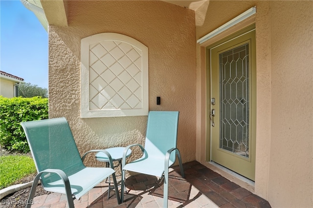 1886 Alameda Dr, Naples, FL 34120 - property entrance featuring stucco siding