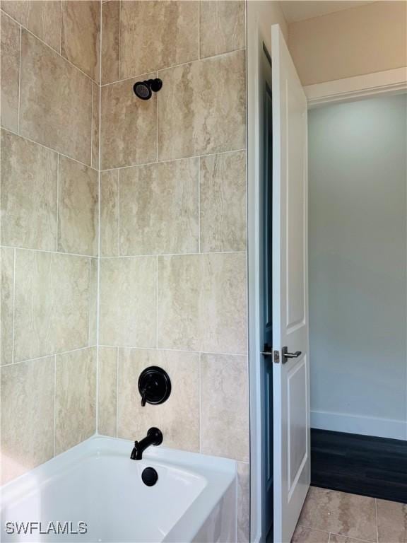 1062 Jay Ct, Labelle, FL 33935 - bathroom with baseboards, shower / bath combination, and tile patterned floors