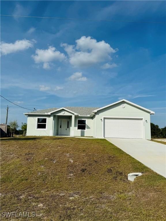 1062 Jay Ct, Labelle, FL 33935 - single story home featuring concrete driveway, a garage, and a front yard