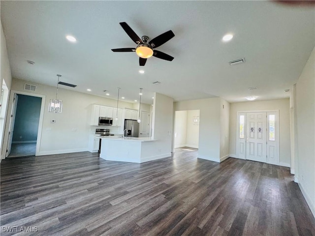 1062 Jay Ct, Labelle, FL 33935 - unfurnished living room with dark wood-style flooring, baseboards, a ceiling fan, and recessed lighting