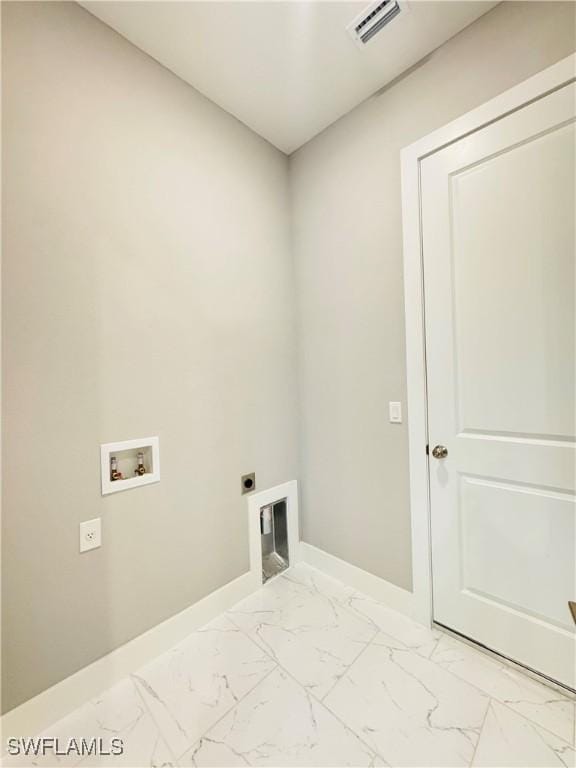 1062 Jay Ct, Labelle, FL 33935 - washroom with electric dryer hookup, light marble finish flooring, washer hookup, and baseboards