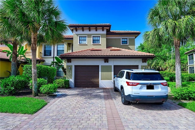 1314 Corso Palermo Ct Unit 1802, Naples, FL 34105 - mediterranean / spanish house with stucco siding, decorative driveway, and a tiled roof