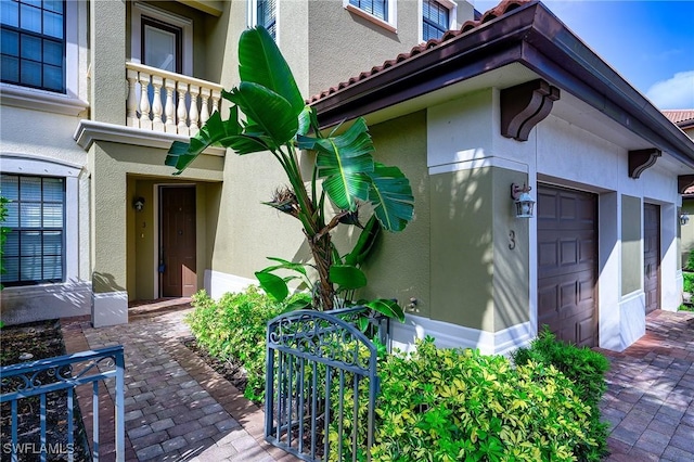 1314 Corso Palermo Ct Unit 1802, Naples, FL 34105 - doorway to property with stucco siding, a balcony, and a tiled roof