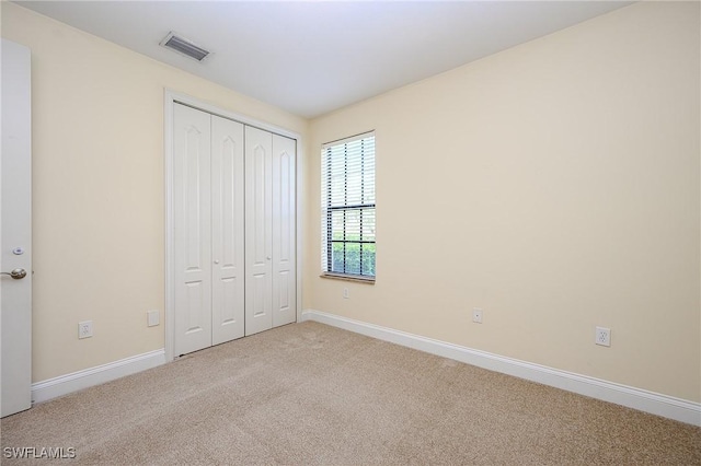 1314 Corso Palermo Ct Unit 1802, Naples, FL 34105 - unfurnished bedroom with carpet floors, baseboards, and a closet
