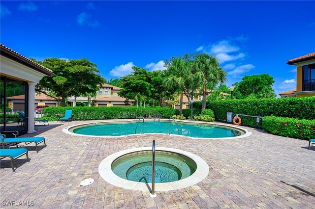 1314 Corso Palermo Ct Unit 1802, Naples, FL 34105 - community pool featuring a hot tub and a patio
