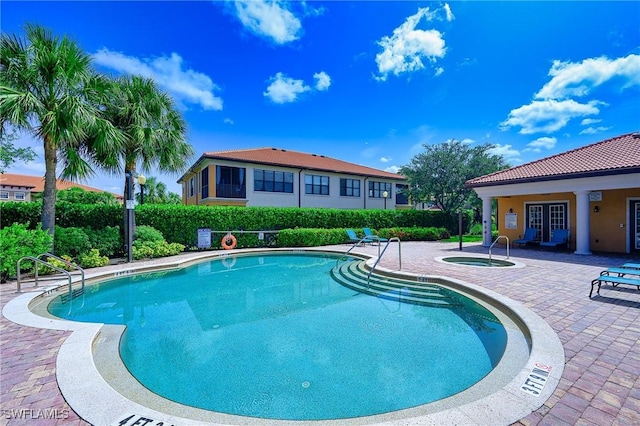 1314 Corso Palermo Ct Unit 1802, Naples, FL 34105 - community pool featuring a community hot tub and a patio