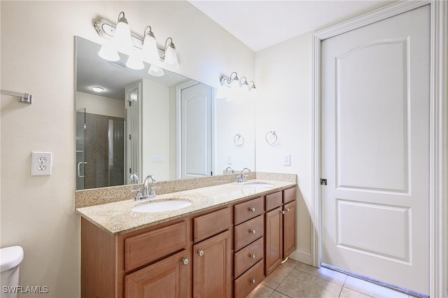 1314 Corso Palermo Ct Unit 1802, Naples, FL 34105 - full bath featuring double vanity, tile patterned flooring, toilet, and a shower with door