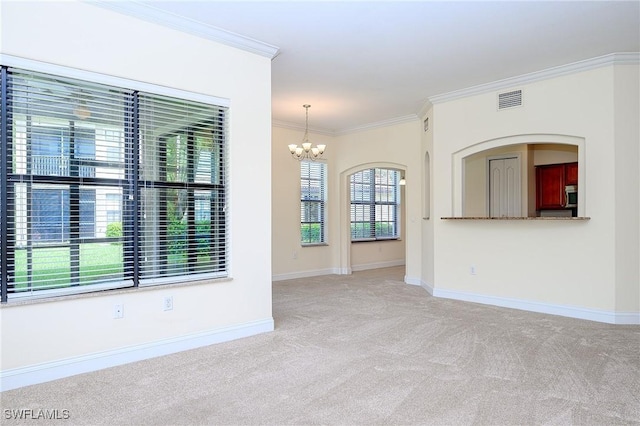 1314 Corso Palermo Ct Unit 1802, Naples, FL 34105 - empty room featuring carpet flooring, a chandelier, crown molding, and baseboards