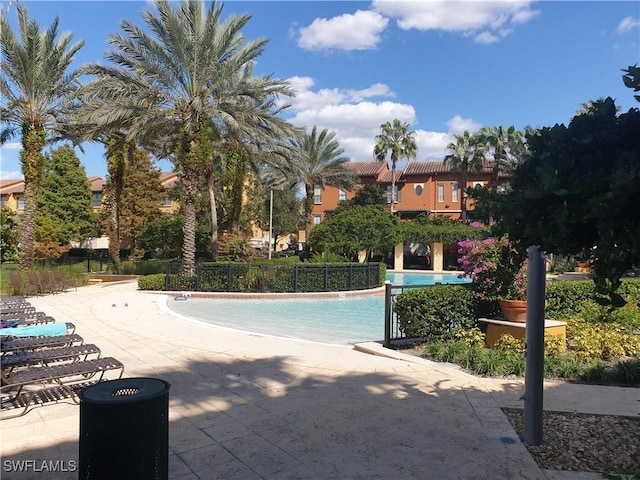 6141 Metrowest Blvd Unit 206, Orlando, FL 32835 - community pool featuring a patio