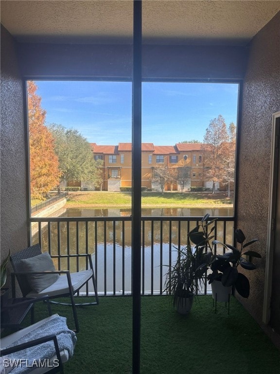6141 Metrowest Blvd Unit 206, Orlando, FL 32835 - balcony featuring a water view