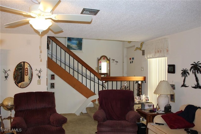 1210 SE 6th Ter Unit 87, Cape Coral, FL 33990 - living room with carpet, a textured ceiling, stairs, and ceiling fan