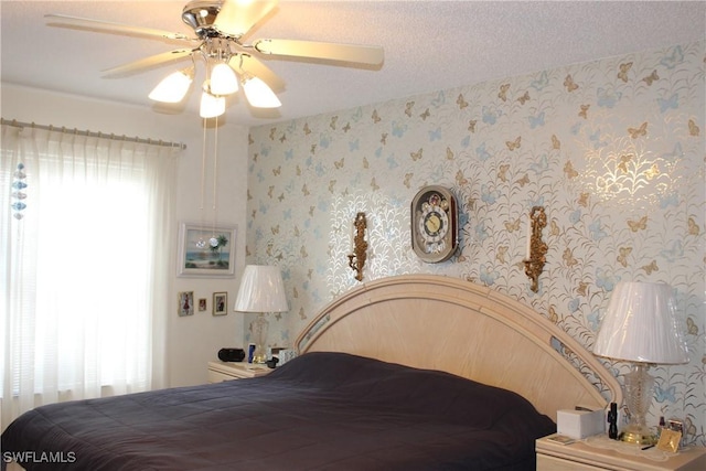 1210 SE 6th Ter Unit 87, Cape Coral, FL 33990 - bedroom featuring wallpapered walls and ceiling fan