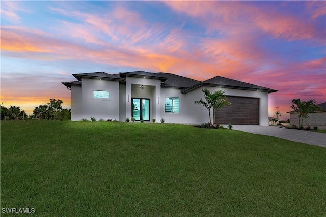 2110 NW 6th Ter, Cape Coral, FL 33993 - view of front of house featuring concrete driveway, stucco siding, a garage, and a front lawn