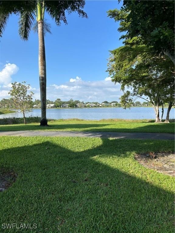 3062 Kings Lake Blvd Unit 7511, Naples, FL 34112 - view of grassy yard featuring a water view