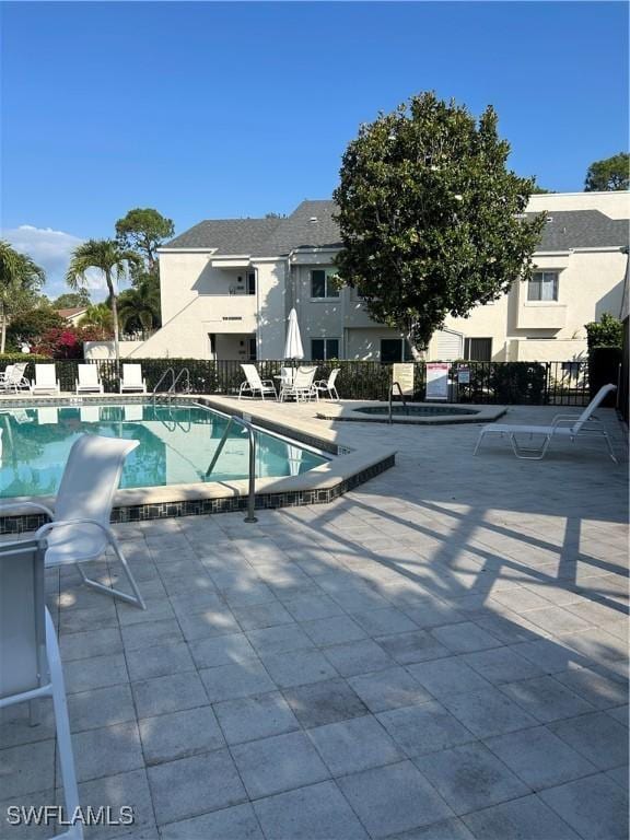 3062 Kings Lake Blvd Unit 7511, Naples, FL 34112 - community pool featuring a patio area