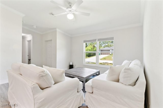 6009 S Moss Cir, Labelle, FL 33935 - living room featuring ornamental molding, ceiling fan, baseboards, and wood finished floors
