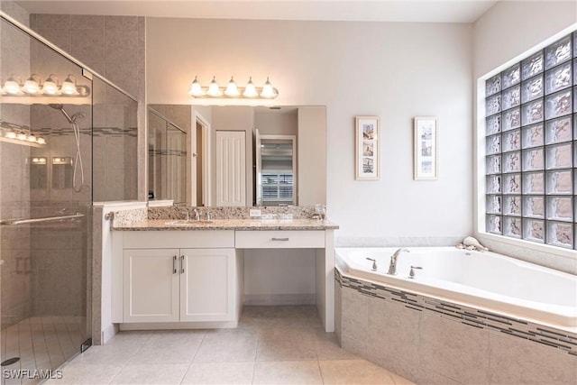 4330 Aurora St, Naples, FL 34119 - full bathroom with vanity, a bath, a shower stall, and tile patterned flooring