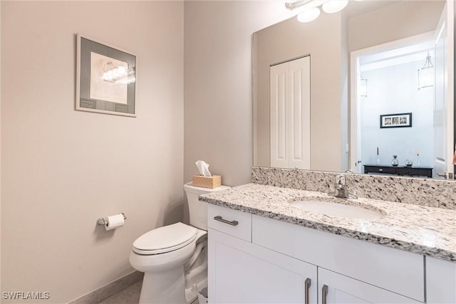 4330 Aurora St, Naples, FL 34119 - bathroom featuring vanity, toilet, baseboards, and tile patterned floors
