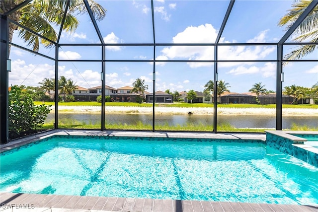 4330 Aurora St, Naples, FL 34119 - view of pool with glass enclosure, a water view, a residential view, and a pool with connected hot tub