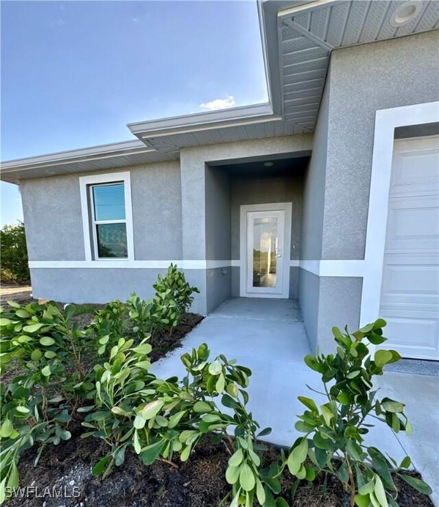 538 David Cir, Labelle, FL 33935 - doorway to property featuring stucco siding