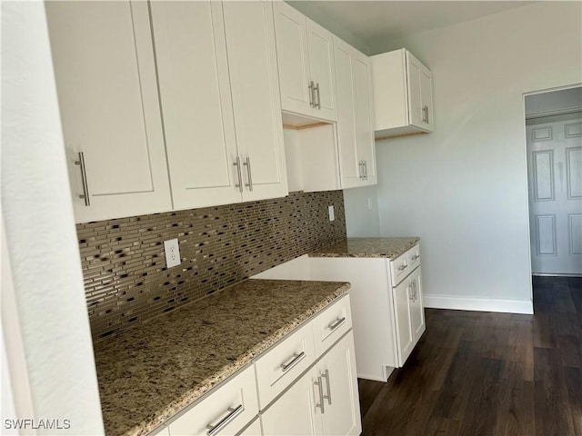 538 David Cir, Labelle, FL 33935 - kitchen featuring baseboards, light stone counters, decorative backsplash, white cabinetry, and dark wood finished floors