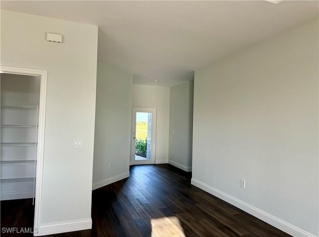 538 David Cir, Labelle, FL 33935 - empty room featuring dark wood-type flooring and baseboards