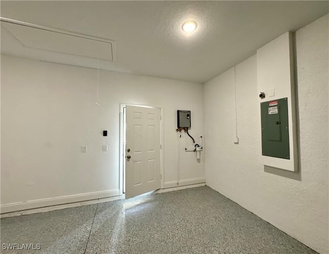538 David Cir, Labelle, FL 33935 - garage with electric panel, a textured wall, and baseboards