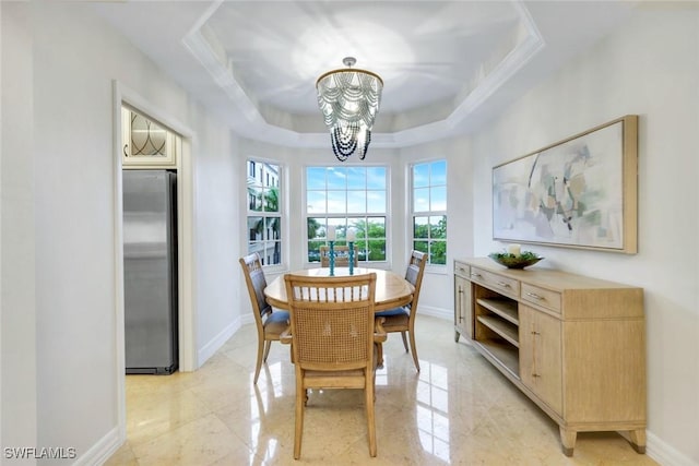 401 Bayfront Pl Unit 3301, Naples, FL 34102 - dining room with a chandelier, baseboards, and a tray ceiling