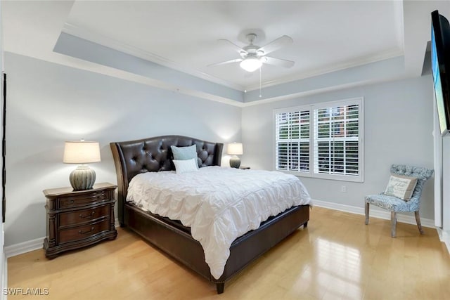 401 Bayfront Pl Unit 3301, Naples, FL 34102 - bedroom with a raised ceiling, light wood-type flooring, crown molding, baseboards, and a ceiling fan