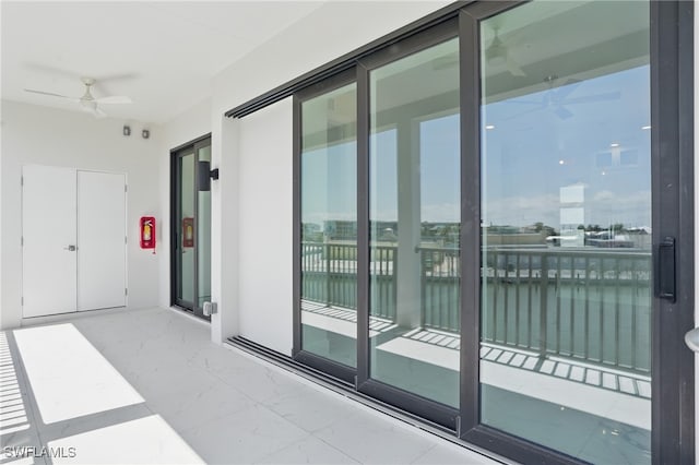 855 Lagoon St Unit 3, Fort Myers Beach, FL 33931 - balcony featuring ceiling fan and a water view