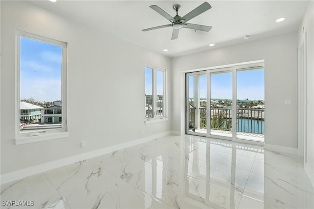 855 Lagoon St Unit 3, Fort Myers Beach, FL 33931 - unfurnished room featuring marble tiled floors, baseboards, and recessed lighting