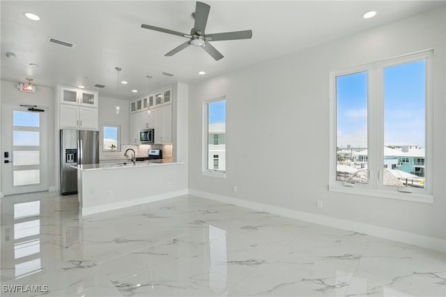 855 Lagoon St Unit 3, Fort Myers Beach, FL 33931 - unfurnished living room featuring baseboards, recessed lighting, ceiling fan, and light marble finish floors