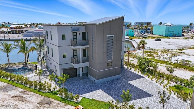 855 Lagoon St Unit 3, Fort Myers Beach, FL 33931 - view of front of home with a garage and decorative driveway