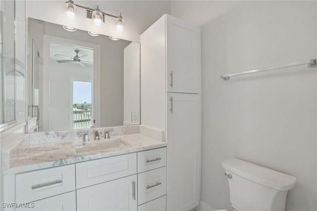855 Lagoon St Unit 4, Fort Myers Beach, FL 33931 - bathroom with vanity, toilet, and ceiling fan