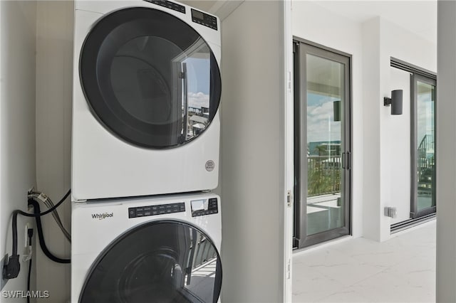 855 Lagoon St Unit 4, Fort Myers Beach, FL 33931 - laundry room with estacked washer and dryer and marble finish floors
