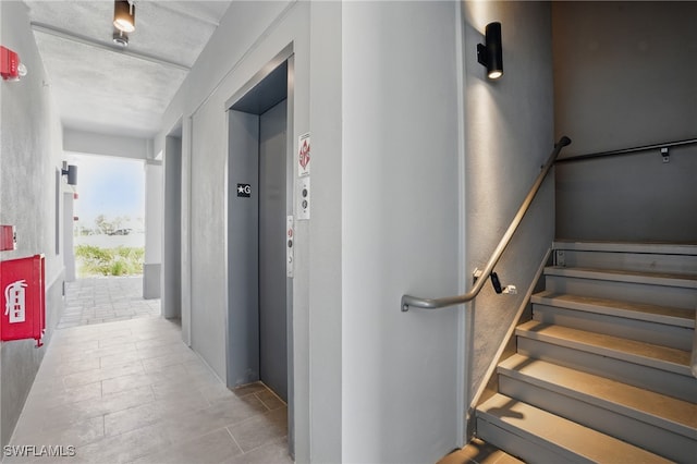 855 Lagoon St Unit 4, Fort Myers Beach, FL 33931 - stairway with elevator and tile patterned flooring