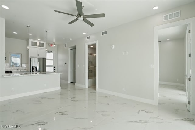 855 Lagoon St Unit 4, Fort Myers Beach, FL 33931 - unfurnished living room with baseboards, recessed lighting, ceiling fan, and light marble finish flooring