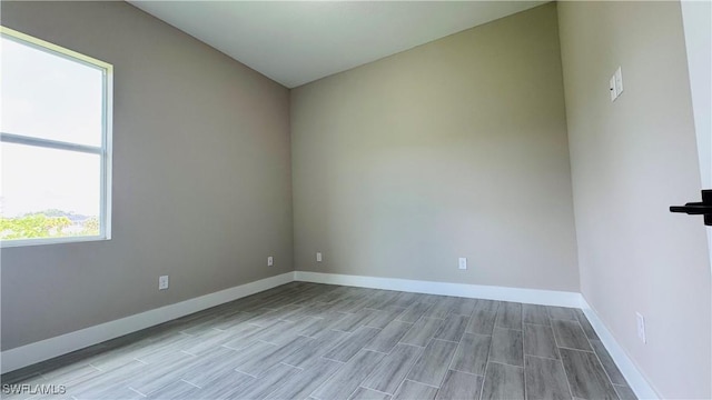 1115 Leader St, Labelle, FL 33935 - empty room featuring baseboards and wood finished floors