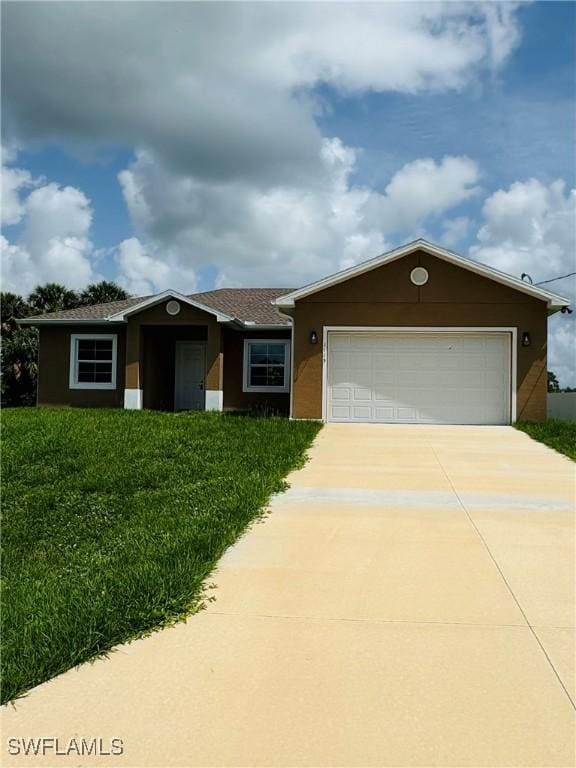 1115 Leader St, Labelle, FL 33935 - ranch-style house featuring driveway, stucco siding, and a garage