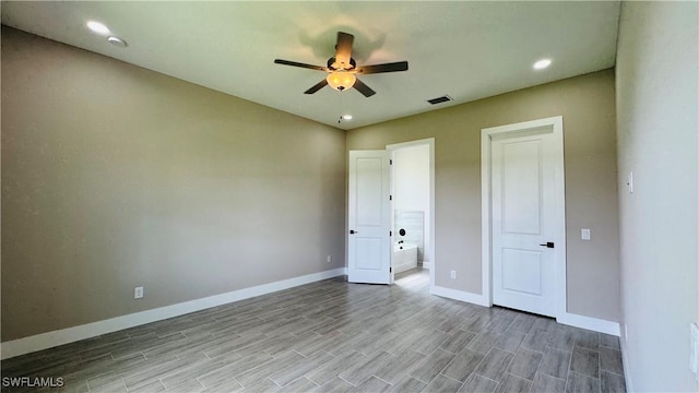 1115 Leader St, Labelle, FL 33935 - unfurnished bedroom with baseboards, wood finished floors, recessed lighting, and a ceiling fan