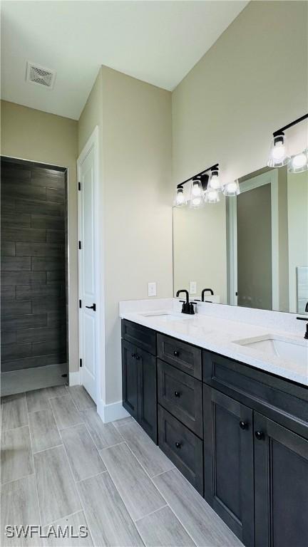 1115 Leader St, Labelle, FL 33935 - full bath featuring double vanity and baseboards