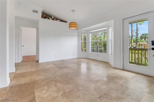 2940 14th Ave SE, Naples, FL 34117 - unfurnished room featuring vaulted ceiling and baseboards