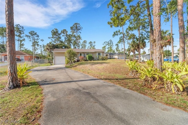 2940 14th Ave SE, Naples, FL 34117 - ranch-style home featuring asphalt driveway and a garage