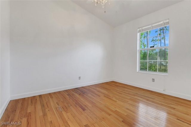 2940 14th Ave SE, Naples, FL 34117 - spare room featuring light wood finished floors and lofted ceiling