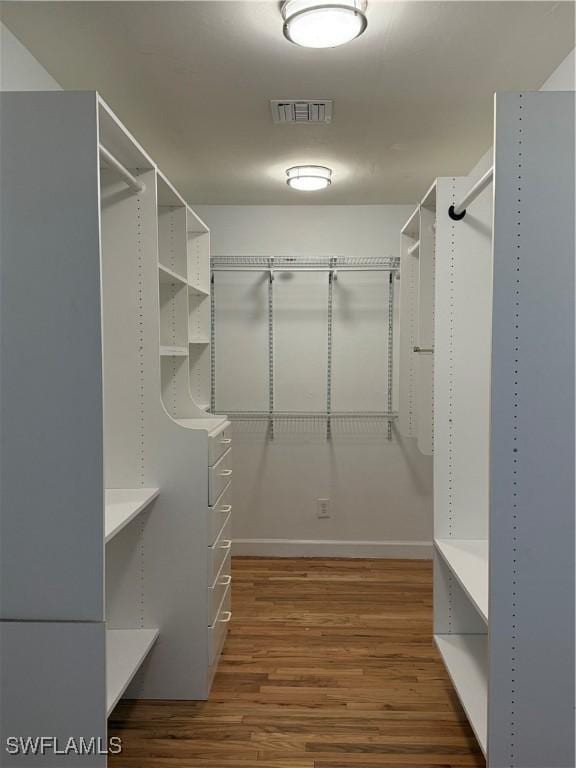 2940 14th Ave SE, Naples, FL 34117 - spacious closet featuring wood finished floors