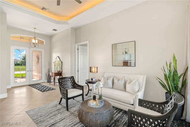 1206 SW 18th Ave, Cape Coral, FL 33991 - living area with a raised ceiling, a chandelier, light tile patterned floors, a high ceiling, and baseboards