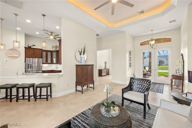 1206 SW 18th Ave, Cape Coral, FL 33991 - living area featuring a ceiling fan, french doors, recessed lighting, a raised ceiling, and baseboards
